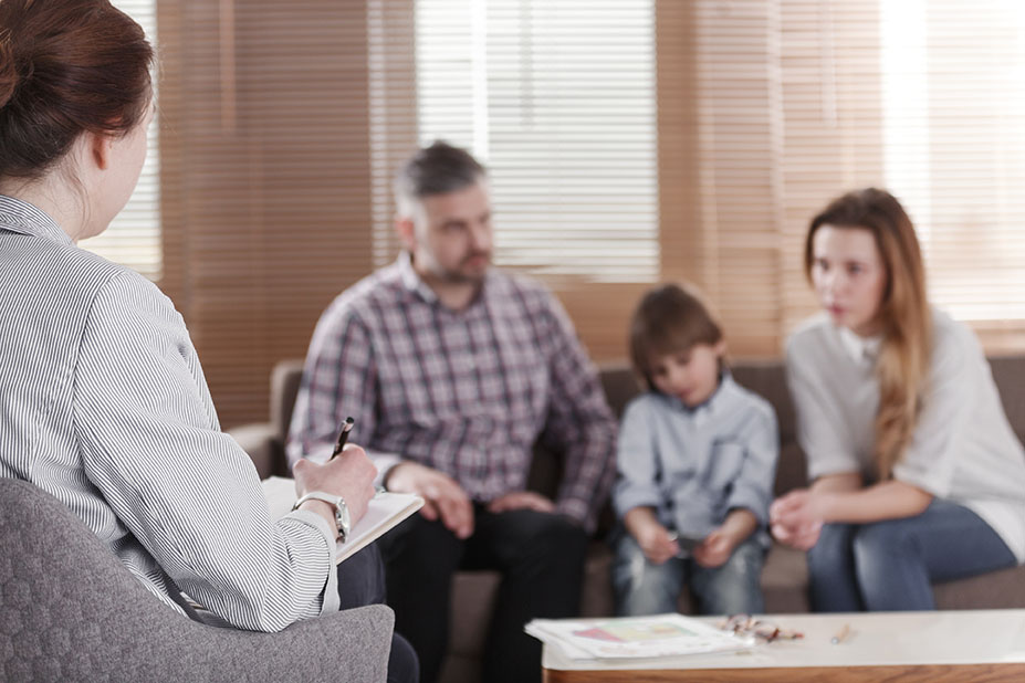 An investigator talking to a family