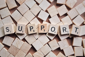 letter blocks that spell out support